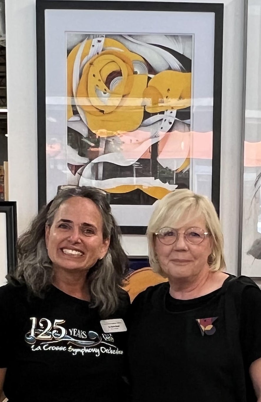 Eva Marie Restel with Jeanne Arenz at River City Gallery on 321 Main Street where the art competition took place for the commemorative art piece for the LSO's 125th season. This picture was taken when "Crescendo" was announced as the winner among 20 beautiful pieces. 