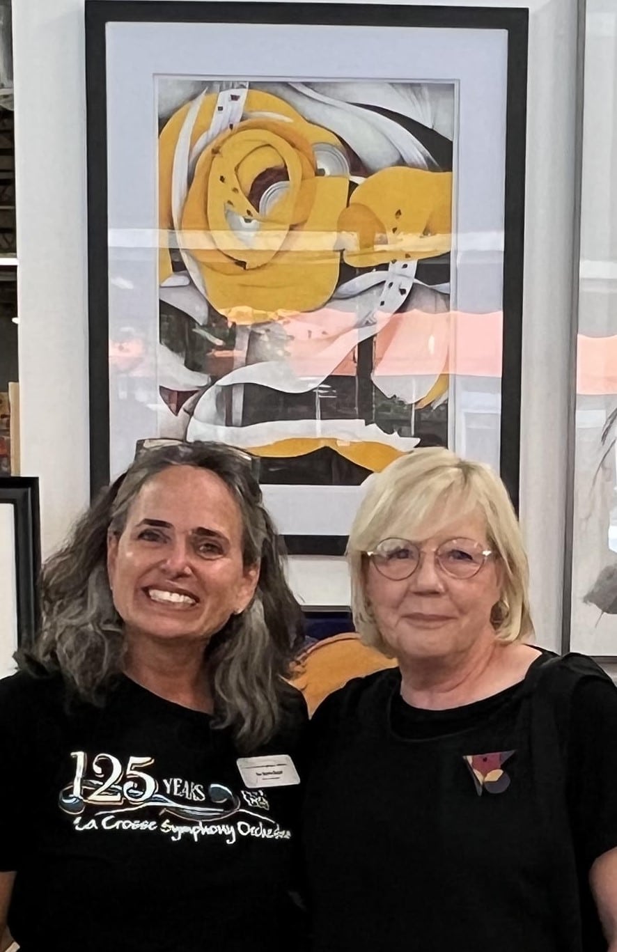 Jeanne Arenz EM and art piece Eva Marie Restel with Jeanne Arenz at River City Gallery on 321 Main Street where the art competition took place for the commemorative art piece for the LSO's 125th season. This picture was taken when "Crescendo" was announced as the winner among 20 beautiful pieces.